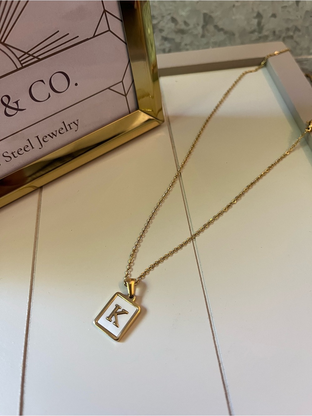 Stainless Steel Gold Initial Necklace Letter “K” with a white inlay.